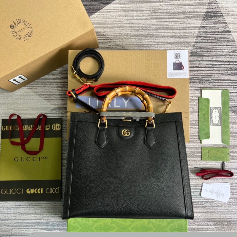 G*u*i top handle bags